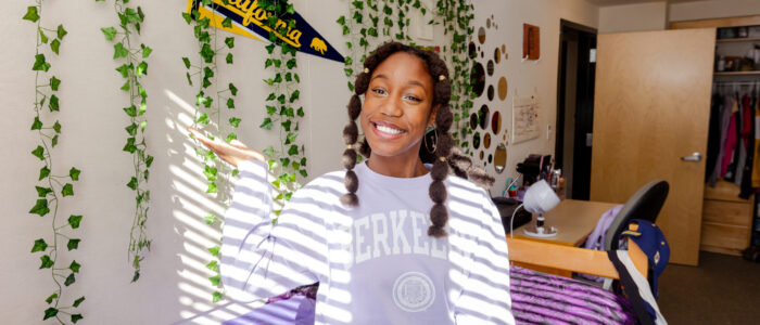 girl in purple Berkeley shirt in dorm